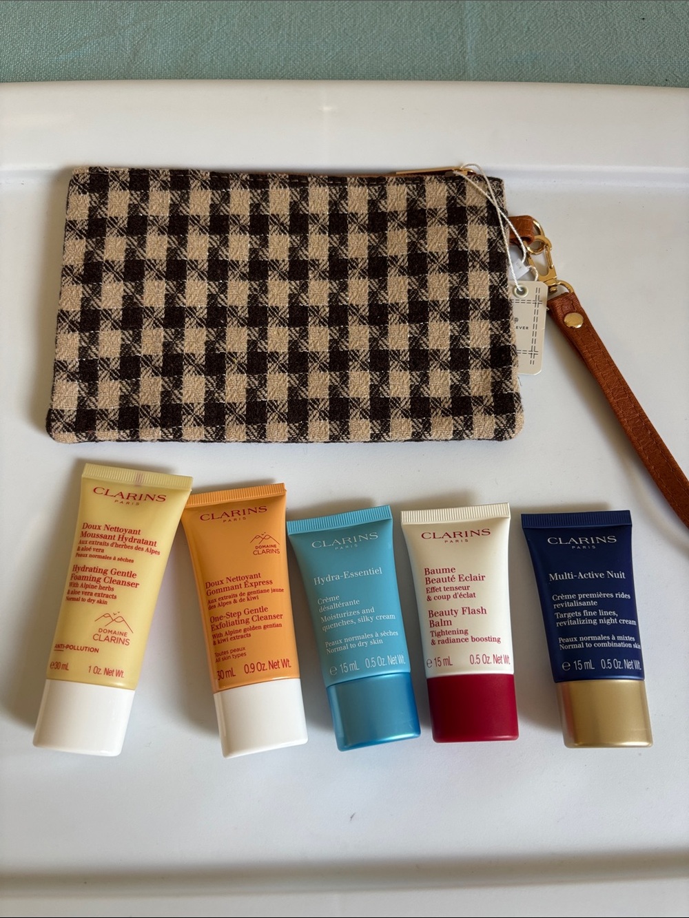 Clarins Travel Skincare Set with Black and Cream Checked Wristlet
